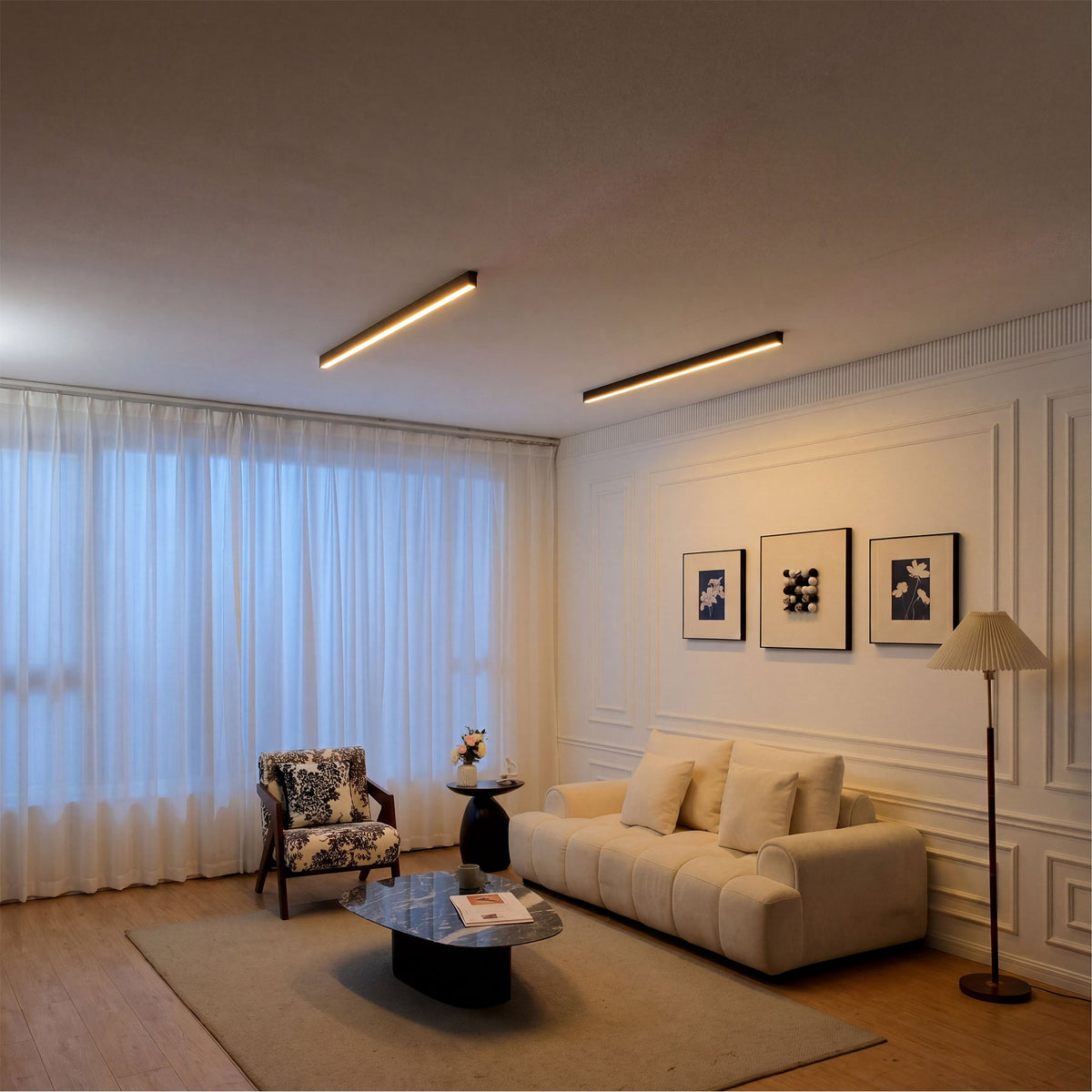 Two black Modern Ceiling Light fixtures
 installed above a warm living room seating area, showing balanced ambient lighting for everyday comfort.