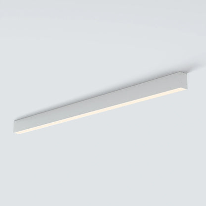 A modern linear LED ceiling light fixture in a sleek rectangular white housing, shown mounted on a plain light gray ceiling.