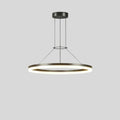 "A modern ring chandelier with a lit ring against a grey background."